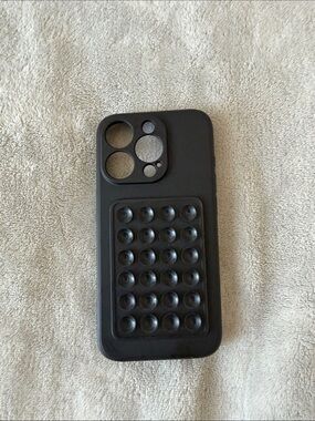 iPhone 15 pro Black Bubble Grip Phone Case with octobuddy attached